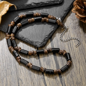 Men's bohemian surfing necklace with black cylindrical beads and brown wood discs