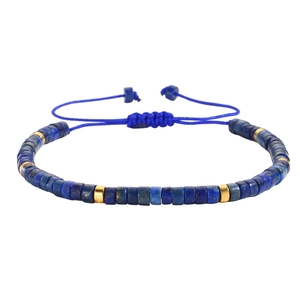 Adjustable bohemian braided bracelet with blue tiger eye beads and golden spacers