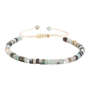 Detail view of woven friendship bracelet with natural stone beads and adjustable cord