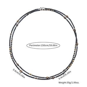 Detail van de kralenketting met zwarte onyx, tijgeroog en houten kralen inclusief afmetingen