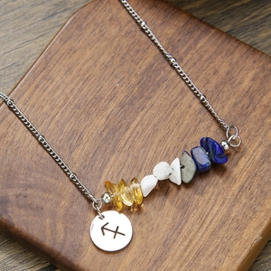 Detail of Sagittarius constellation pendant with natural mixed stone chips on a chain