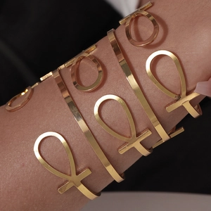 Set of gold Ankh cross open bangles for women featuring Egyptian ethnic style stacked design