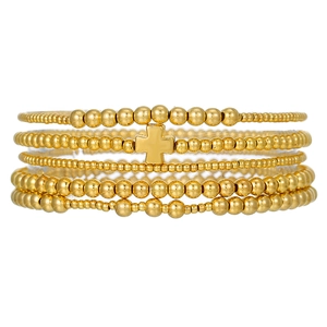 Five-layer stacked golden beaded bracelet set with minimalist cross pendant on white background