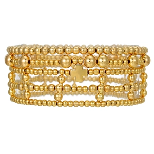 Layered gold beaded bracelet set with cross pendant and elastic stretch cords