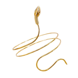 Golden spiral snake arm cuff with detailed scales and a vintage minimalist design