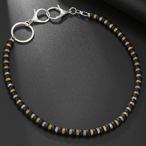 Chaîne de pantalon vintage en perles noires mates avec détails gravés or et argent