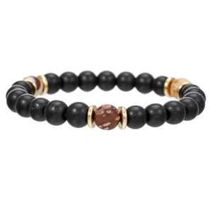 Vista detallada de la pulsera artesanal de piedra volcánica con vetas de mármol y oro fino