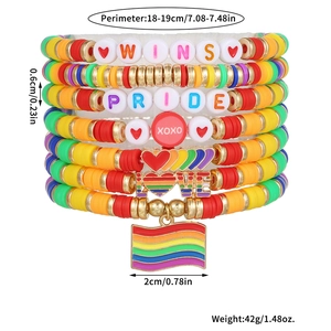 Detailed view of rainbow bead bracelets with Pride charms and layered elastic clay beads