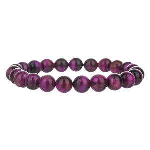 Macro detail of purple tiger eye crystal beads showing cat-eye effect and fiber texture