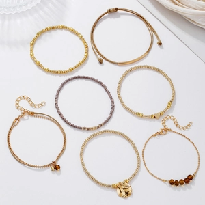 7-piece bohemian bead bracelet set with heart charms and gold metallic beads for women
