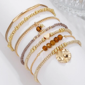 Bohemian 7-piece beaded bracelet set with gold heart charms and amber resin beads