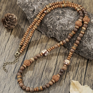Bohemian men's coconut shell wood bead necklace with engraved accents on natural wood