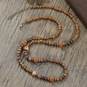 Bohemian beaded necklace with coconut shell wood beads and bronze lobster clasp