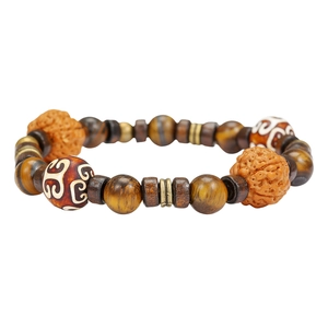 Handmade ethnic beaded bracelet featuring natural tiger eye stone and dZi beads style