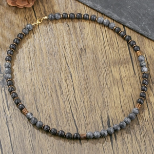 Opvallende kralenketting met lavasteen en antieke bronzen spiraalaccenten voor heren