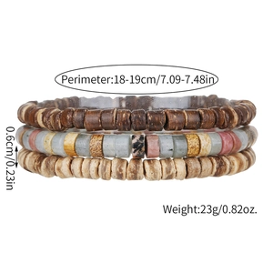Close-up of three stacked bracelets featuring natural wood and stone beads in earthy tones