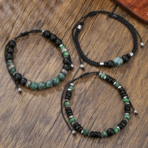 Stackable retro bracelets with black agate, turquoise beads and silver accents on wood