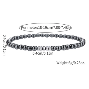 Detail van een 6mm onyx en hematiet kralenarmband met zilveren tussenringen