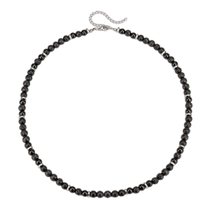 Close-up of beaded necklace featuring black lava stone and agate with lobster clasp detail