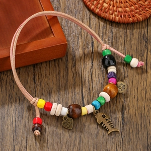 Handmade wooden bead pet necklace with heart and fishbone charms on leather cord