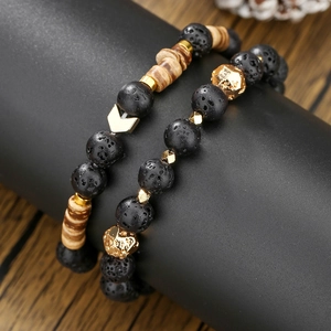 Men's beaded bracelet set with black lava stone, wood beads and gold chevron charm