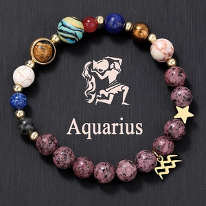 Detailed macro view of Aquarius zodiac bracelet with natural stone beads and gold charms