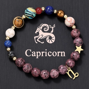 Detailed view of Capricorn natural stone beaded bracelet with golden star and zodiac charms