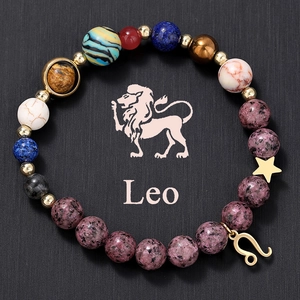 Macro shot of Leo constellation beaded bracelet with natural tiger eye and zodiac charm
