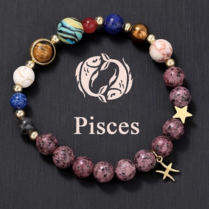 Detailed macro view of Pisces natural stone beaded bracelet with zodiac and star charms