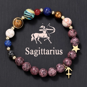 Close-up of Sagittarius natural stone beaded bracelet with solar system planet theme
