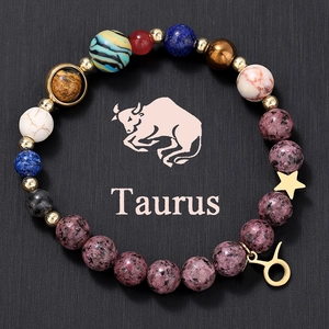 Macro detail of Taurus zodiac beaded bracelet featuring multi-color natural planetary stones