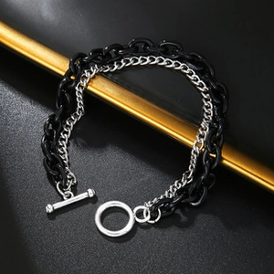 Detail of double-layer layered bracelet with black resin and silver OT buckle clasp