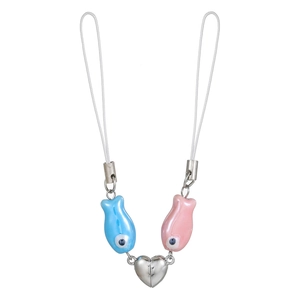 Detail of magnetic couple fish charms in pink and blue with a silver heart connector