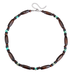 Detail of bohemian wood bead necklace with turquoise stones and adjustable metal clasp