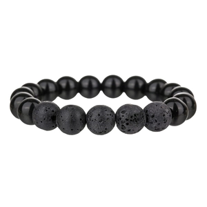 Detailed view of polished obsidian and porous lava stone beads on a stretch bracelet