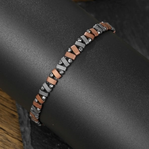 Herenarmband met hematiet kralen en matte grijze en bronzen metalen schakels