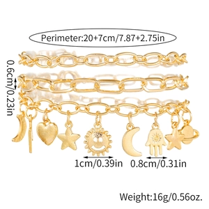 Pulsera de eslabones cubanos chapada en oro con dijes de corazón y estrella en blanco