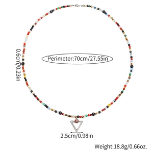 Ethnic beaded necklace with colorful glass beads and silver triangle pendant with red stone