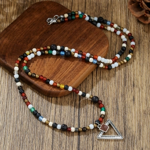 Ethnic beaded necklace with colorful volcanic stones and silver triangle pendant