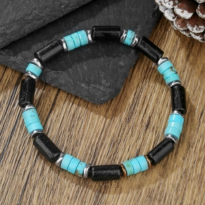 Detail of beaded bracelet with tiger eye stones and wood beads on rustic wooden background