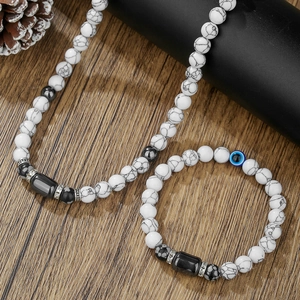 Conjunto de collar y pulsera de turquesa blanca y hematita con amuleto ojo turco azul