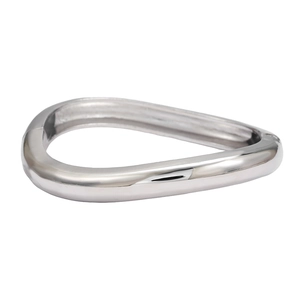 Polished silver geometric spring cuff bracelet with a modern minimalist metallic finish