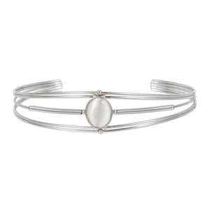 Elegant silver-colored stainless steel open bangle with centered oval white gemstone