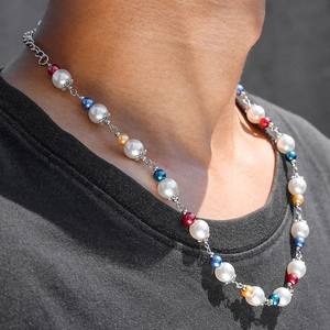 Hip hop pearl necklace featuring colorful beads and silver metal chain on male model