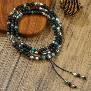 Retro multi-layer wrap bracelet featuring black matte beads and turquoise stones