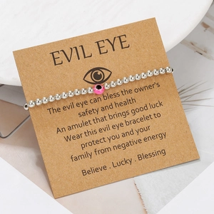 Pink evil eye bead bracelet on display card with minimalist silver beads for friendship gift