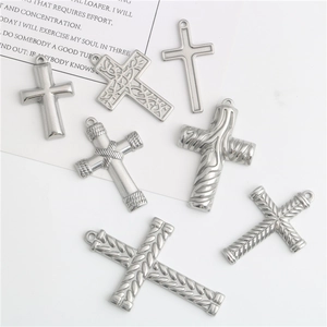 Seven unique stainless steel cross pendants featuring vintage carvings and rope textures