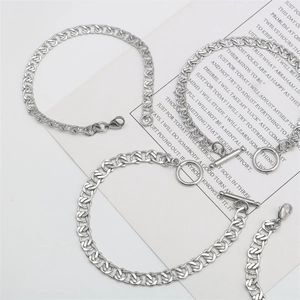 Detailed view of silver stainless steel chain bracelets with lobster and OT clasp designs