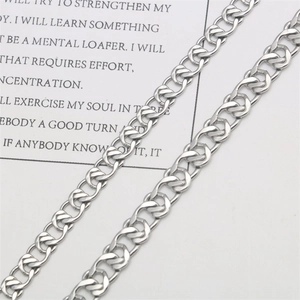 Bold stainless steel curb chain bracelet with polished hollow heart links in silver finish