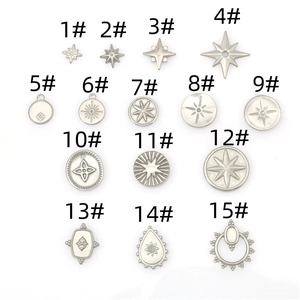 Macro display of 15 stainless steel star and cross pendants for DIY jewelry making